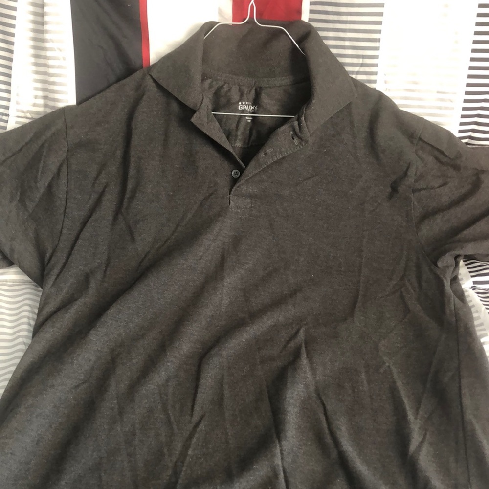 Gray short sleeve collared shirt.